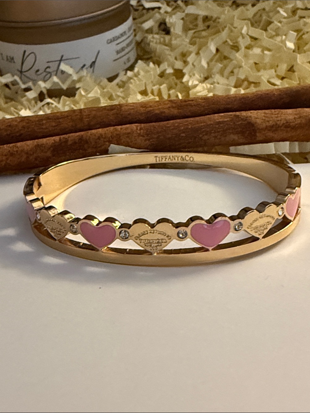 Gold Bangle with Pink Heart Motifs